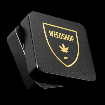 Close-up of WS O.G. metal grinder showing sharp teeth and magnetic lid